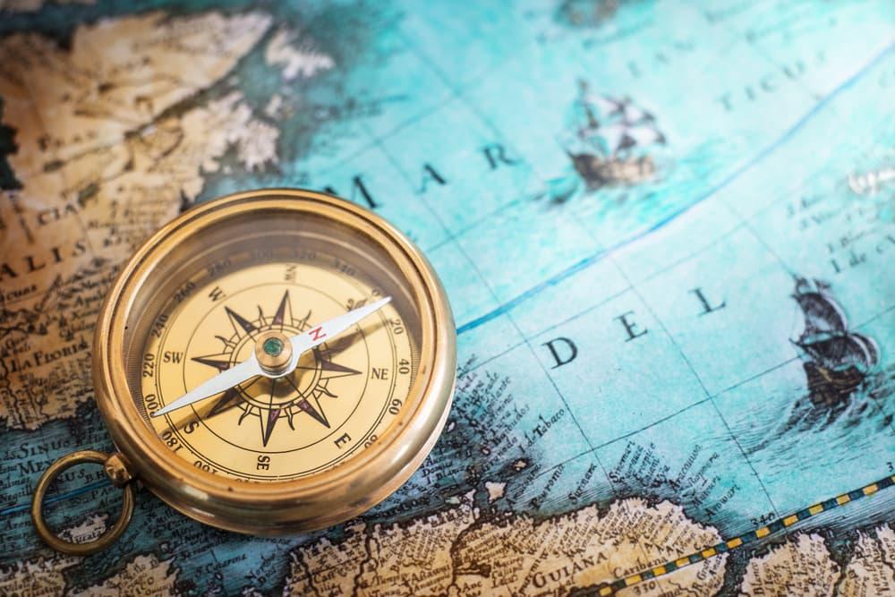 An old compass on a map.