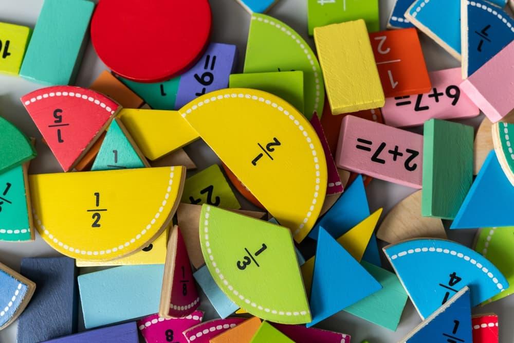 Pile of colorful fraction math manipulatives.