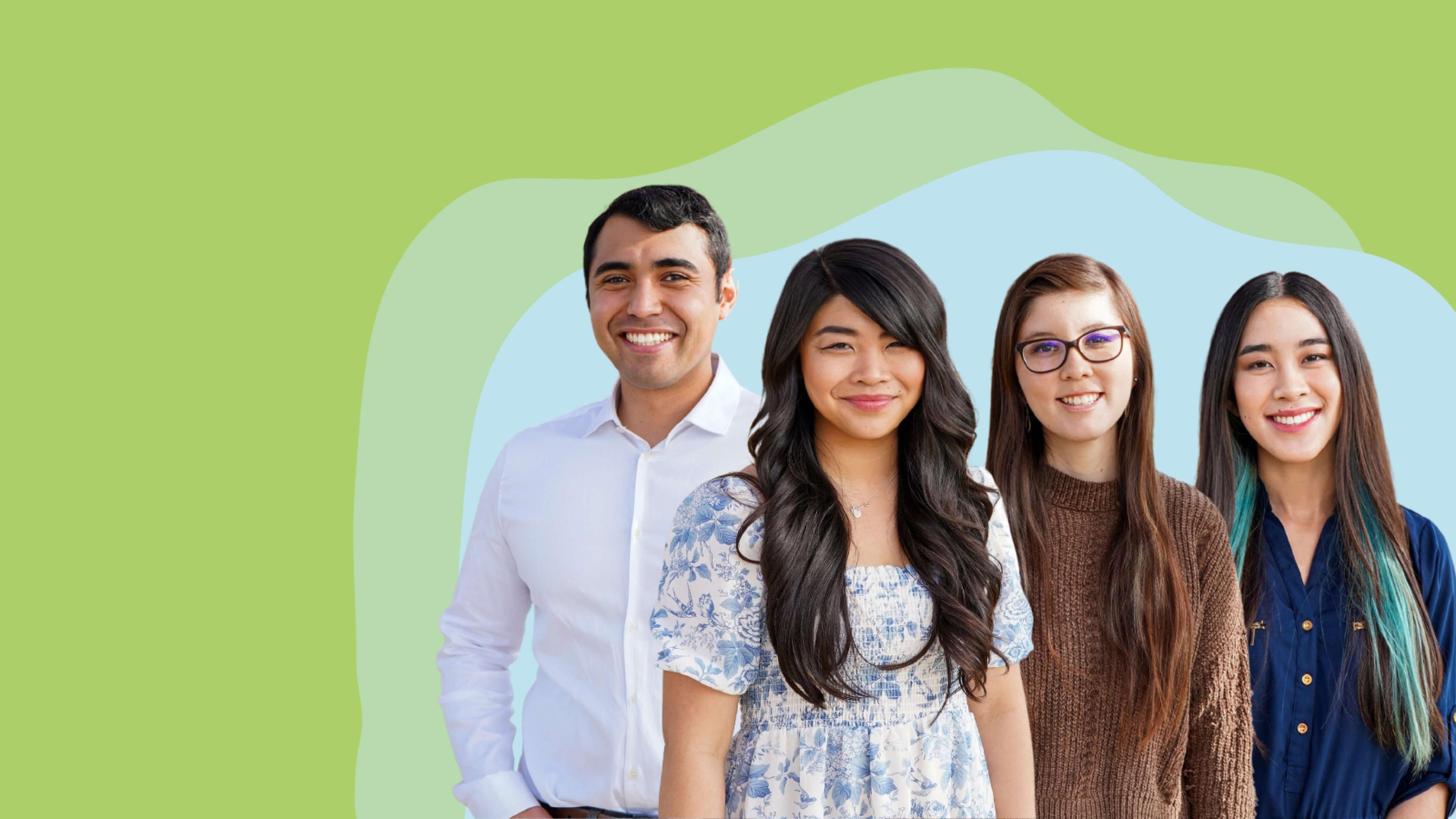 Three female and one male teacher standing together.