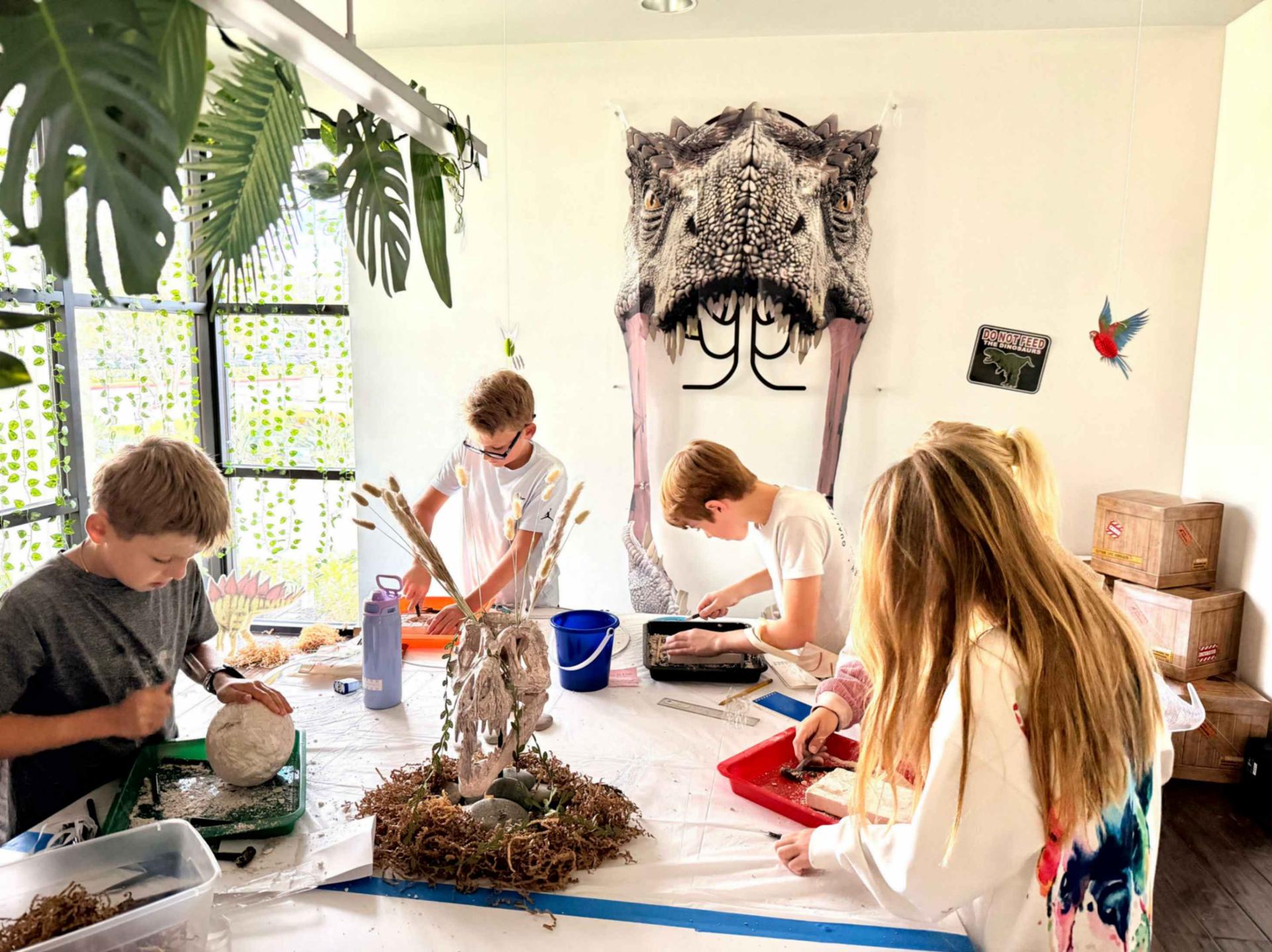 Students participating in a Jurassic-themed escape room.