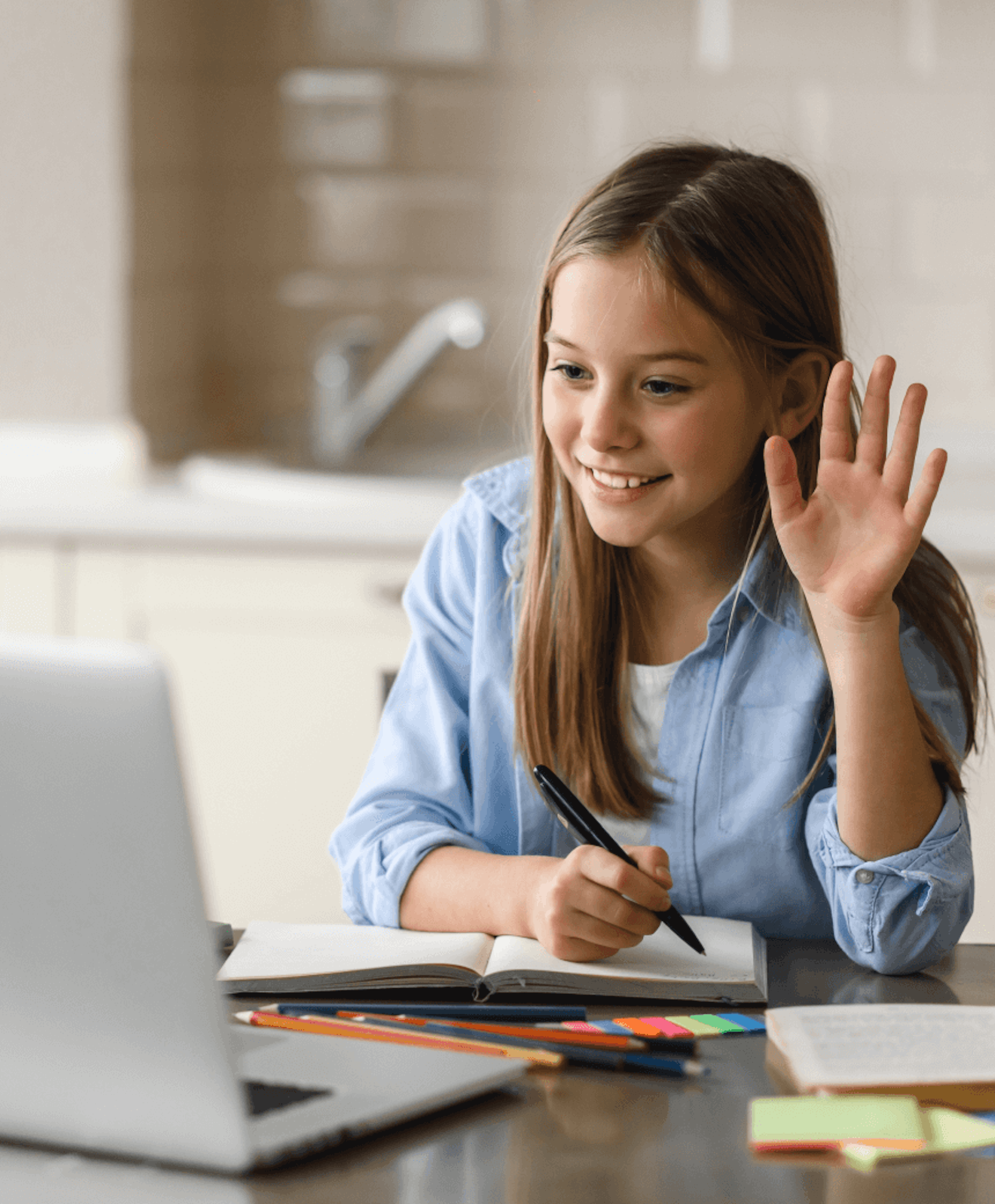 A girl raising her hand in an online class